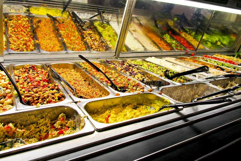 Restaurant kitchen with chef preparing food and delivery orders